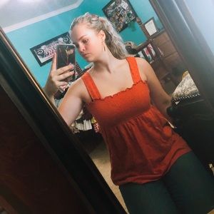 Burnt orange colored haltered top.